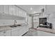 Galley kitchen with white cabinets, granite countertops and stainless-steel appliances at 523 W Hancock St, Lakeland, FL 33803