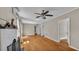 Bright living room featuring hardwood floors, a white fireplace, and several doorways at 523 W Hancock St, Lakeland, FL 33803
