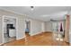 Open-concept living room with hardwood floors, multiple doorways, and neutral wall colors at 523 W Hancock St, Lakeland, FL 33803