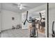 Bright bonus room with white tile floors and an open doorway to the dining area at 5246 Montserrat Dr, Lakeland, FL 33812