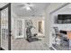 Well-lit bonus room featuring bright white tile floors and doorways to other areas of the home at 5246 Montserrat Dr, Lakeland, FL 33812