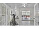 Bright exercise room with tile floor, including a pool table and elliptical machine at 5246 Montserrat Dr, Lakeland, FL 33812