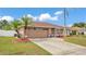 Charming single-story home featuring a two-car garage, well-maintained landscaping, and attractive curb appeal at 5246 Montserrat Dr, Lakeland, FL 33812
