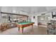 Spacious game room featuring a pool table and access to the main house and outdoor space at 5246 Montserrat Dr, Lakeland, FL 33812