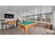 Large, bright, updated game room with a billiard table and durable flooring, great for entertaining at 5246 Montserrat Dr, Lakeland, FL 33812