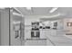 Bright kitchen with stainless steel appliances, white cabinets, and tile flooring at 5246 Montserrat Dr, Lakeland, FL 33812