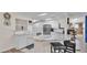 Well-lit kitchen with white cabinets, stainless steel appliances, and a marble countertop island at 5246 Montserrat Dr, Lakeland, FL 33812