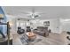 Spacious living room with hardwood floors and comfortable seating furniture at 5246 Montserrat Dr, Lakeland, FL 33812