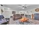 Open-concept living room with hardwood floors and a connecting kitchen space at 5246 Montserrat Dr, Lakeland, FL 33812