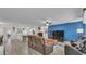 Comfortable living room with hardwood floors and a connecting kitchen space at 5246 Montserrat Dr, Lakeland, FL 33812