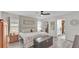 The main bedroom features wood laminate flooring, a ceiling fan, and an ensuite bath with a walk-in closet at 5246 Montserrat Dr, Lakeland, FL 33812