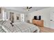 The main bedroom features wood laminate flooring, a ceiling fan, and ensuite bathroom access at 5246 Montserrat Dr, Lakeland, FL 33812