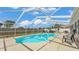 Relax in this private screened-in pool with a spacious deck and an attached sunroom at 5246 Montserrat Dr, Lakeland, FL 33812
