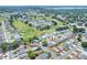 An aerial view displays the home's location within a golf course community at 525 Eagle Run, Lakeland, FL 33809