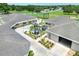 Aerial view of community buildings with landscaping and a nearby golf course at 525 Eagle Run, Lakeland, FL 33809
