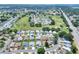 An aerial view displays the home's location within a golf course community at 525 Eagle Run, Lakeland, FL 33809