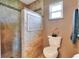 Newly renovated bathroom with tiled walk-in shower, tiled accent wall and neutral decor at 525 Eagle Run, Lakeland, FL 33809