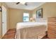Bedroom with wood floors, light colored walls, window with blinds, and closet space at 525 Eagle Run, Lakeland, FL 33809