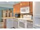 Bright kitchen featuring two-tone cabinets, updated appliances, and ample counter space, ready for cooking at 525 Eagle Run, Lakeland, FL 33809