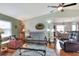Open-concept living room offering a spacious seating arrangement with views into the dining area at 525 Eagle Run, Lakeland, FL 33809