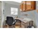 This home office features built-in shelving, natural light, and neutral tones at 525 Eagle Run, Lakeland, FL 33809