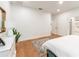 Bright bedroom featuring hardwood floors, recessed lighting, and an en-suite bathroom at 527 W Park St, Lakeland, FL 33803