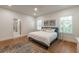 Bright bedroom with hardwood floors, ample natural light, and stylish decor at 527 W Park St, Lakeland, FL 33803