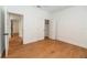 Bright bedroom features wood flooring, closet with doors and a ceiling fan at 527 W Park St, Lakeland, FL 33803