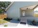 Craftsman-style home features brick steps, gravel walkway, and a covered porch at 527 W Park St, Lakeland, FL 33803