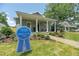 Beautiful home with 'Home of the Year' sign, landscaped yard, and inviting front porch at 527 W Park St, Lakeland, FL 33803