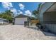 A detached garage and a lovely home with a black fence creating a welcoming outdoor space at 527 W Park St, Lakeland, FL 33803