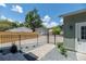 Exterior view shows the driveway, and fenced yard of this home at 527 W Park St, Lakeland, FL 33803
