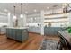Well-lit kitchen featuring an island, modern cabinets, and open shelving at 527 W Park St, Lakeland, FL 33803
