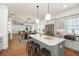 Open-concept kitchen with island, pendant lighting, modern appliances, connecting to the dining and living area at 527 W Park St, Lakeland, FL 33803