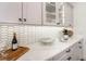 Modern kitchen with white countertops, sleek cabinets, and stylish backsplash at 527 W Park St, Lakeland, FL 33803