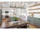 Modern kitchen features stainless steel appliances, island, and a view to the dining room at 527 W Park St, Lakeland, FL 33803