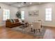 Bright living room with modern decor, beamed ceilings, lots of natural light at 527 W Park St, Lakeland, FL 33803