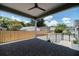 Covered patio features brick pavers, fencing, and a view to the backyard at 527 W Park St, Lakeland, FL 33803