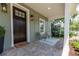 Inviting porch with brick floor, decorative lanterns, comfortable seating, and a welcoming atmosphere at 527 W Park St, Lakeland, FL 33803
