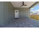 A spacious outdoor area with a stylish ceiling fan and a beautiful brick-paved floor at 527 W Park St, Lakeland, FL 33803