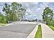 Community bridge featuring a smooth asphalt surface and pedestrian walkways in a scenic setting at 580 Jett Ln, Davenport, FL 33837