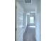 Well-lit hallway with carpeted floor and recessed lighting at 580 Jett Ln, Davenport, FL 33837