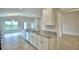 Bright kitchen featuring granite countertops, stainless steel appliances, and ample cabinet space at 580 Jett Ln, Davenport, FL 33837