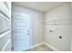 A practical laundry room is complete with a wire shelf for optimal organization and storage at 580 Jett Ln, Davenport, FL 33837