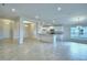 Bright and open living space with tile floors and a seamless transition to the kitchen, filled with natural light at 580 Jett Ln, Davenport, FL 33837