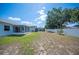 Exterior view highlighting the fenced backyard with a covered patio, pool and established landscaping at 603 Reflections Loop, Winter Haven, FL 33884