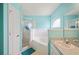 Relaxing bathroom featuring a soaking tub, tiled shower, and white vanity with ample counter space at 603 Reflections Loop, Winter Haven, FL 33884