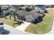 Aerial view of the home and landscaped front yard with a palm tree at 633 Heather Glen Loop, Winter Haven, FL 33884