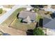An aerial view displays a quaint single Gathering home with a fenced yard and a screened-in porch at 633 Heather Glen Loop, Winter Haven, FL 33884