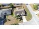Aerial view of the home with a long driveway on a corner lot at 633 Heather Glen Loop, Winter Haven, FL 33884